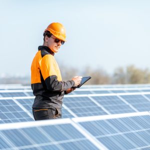 engineer-servicing-solar-panel-on-electric-plant.jpg engineer-servicing-solar-panel-on-electric-plant.jpg